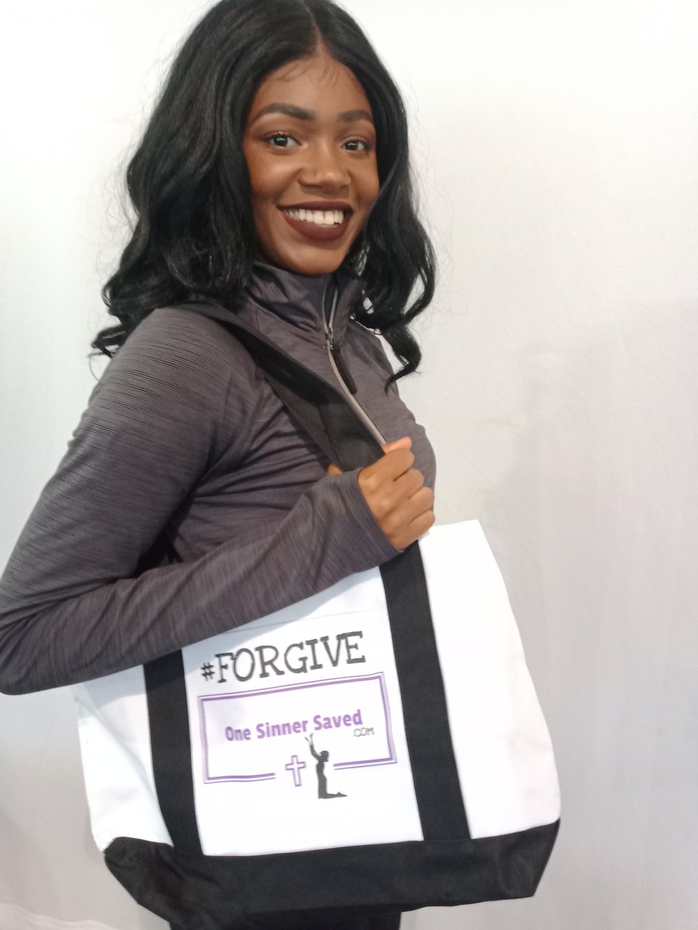 OneSinnerSaved.com #FORGIVE tote bag modeled by Brittney Smith of Kentucky.